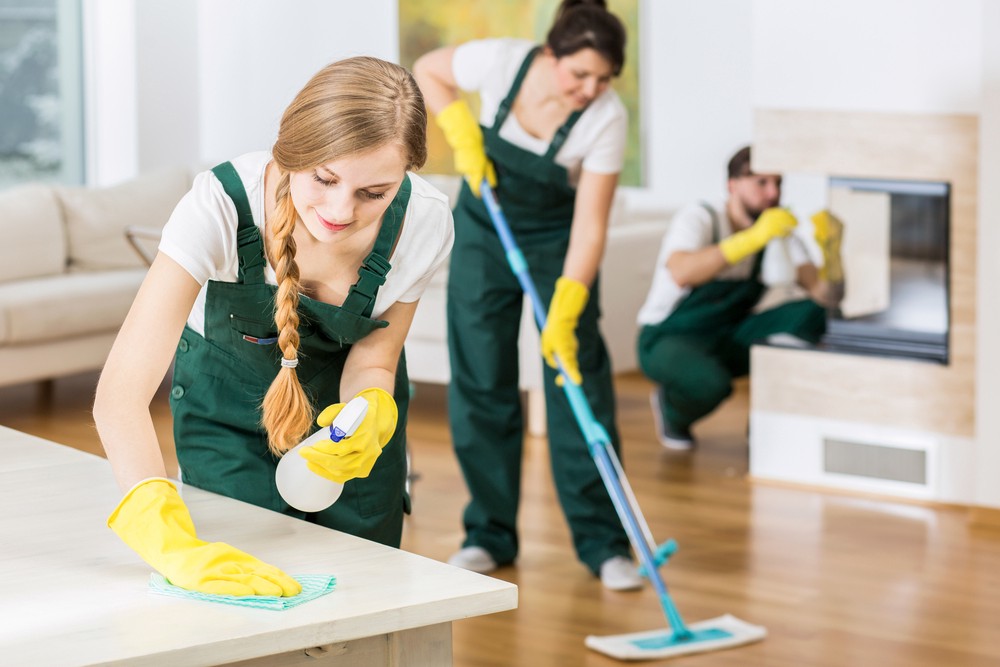 Commercial cleaning team cleaning a room