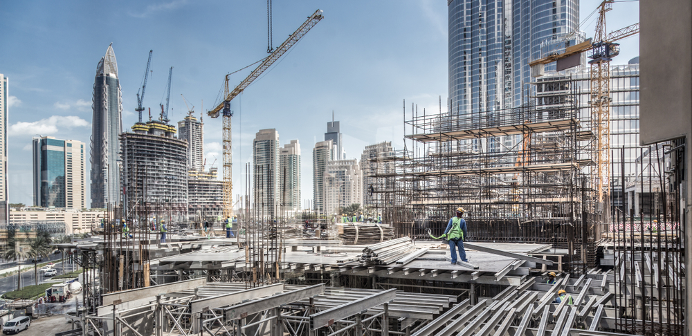 City construction site with cranes and scaffolding