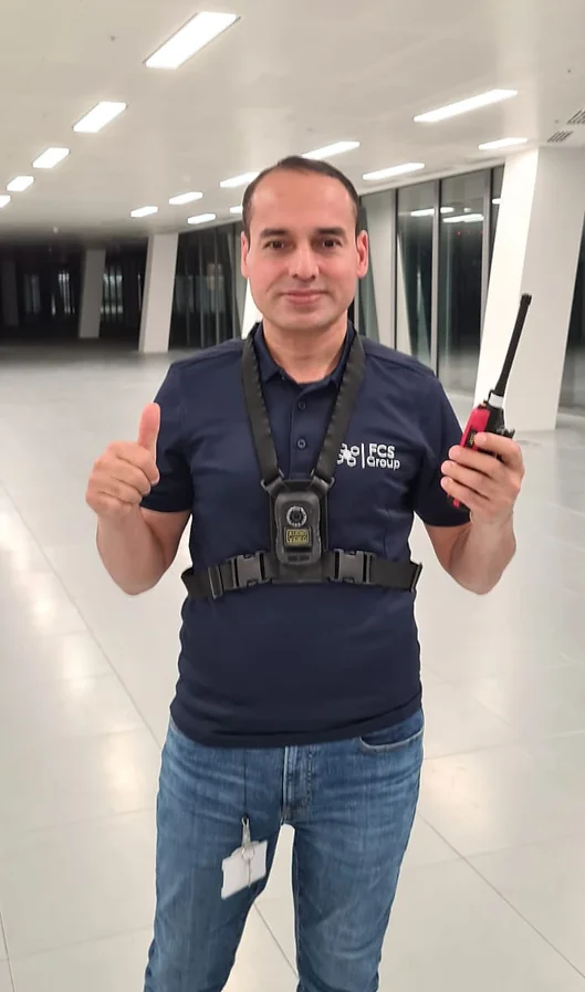 FCS Group security officer giving a thumbs up in an office building