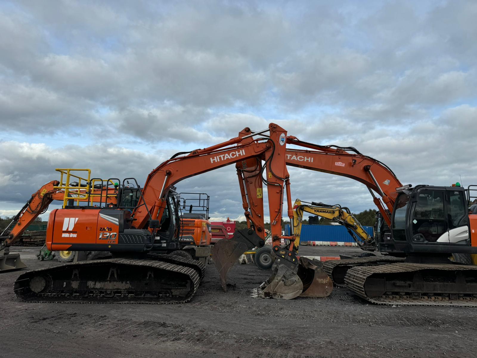 Tracked excavators and heavy plant parked on a UK construction site