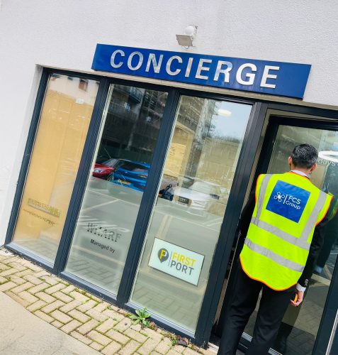 FCS Group concierge security officer at a building entrance
