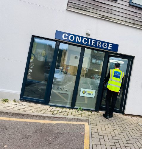 Concierge security officer on duty at a residential building entrance
