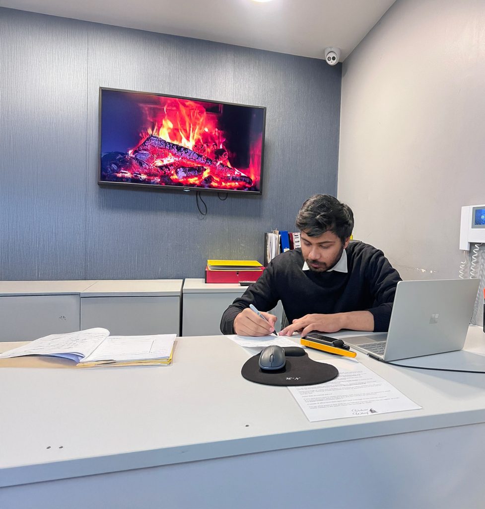 FCS Group front desk officer logging visitors at reception