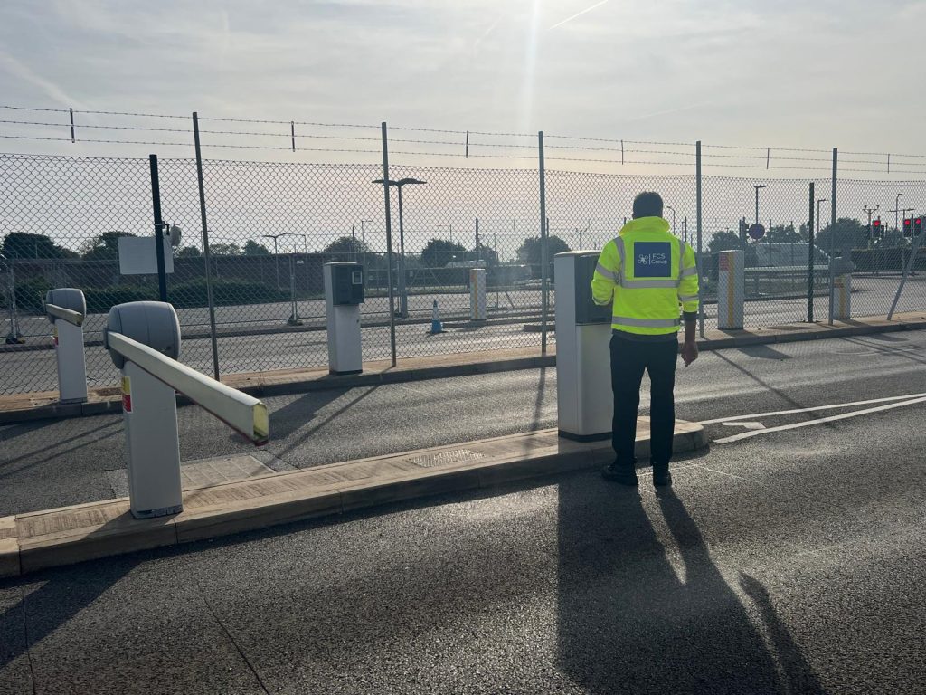 SIA-licensed security officer on duty at a site vehicle barrier