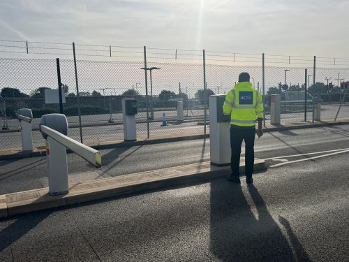 SIA-licensed security officer on duty at a site vehicle barrier
