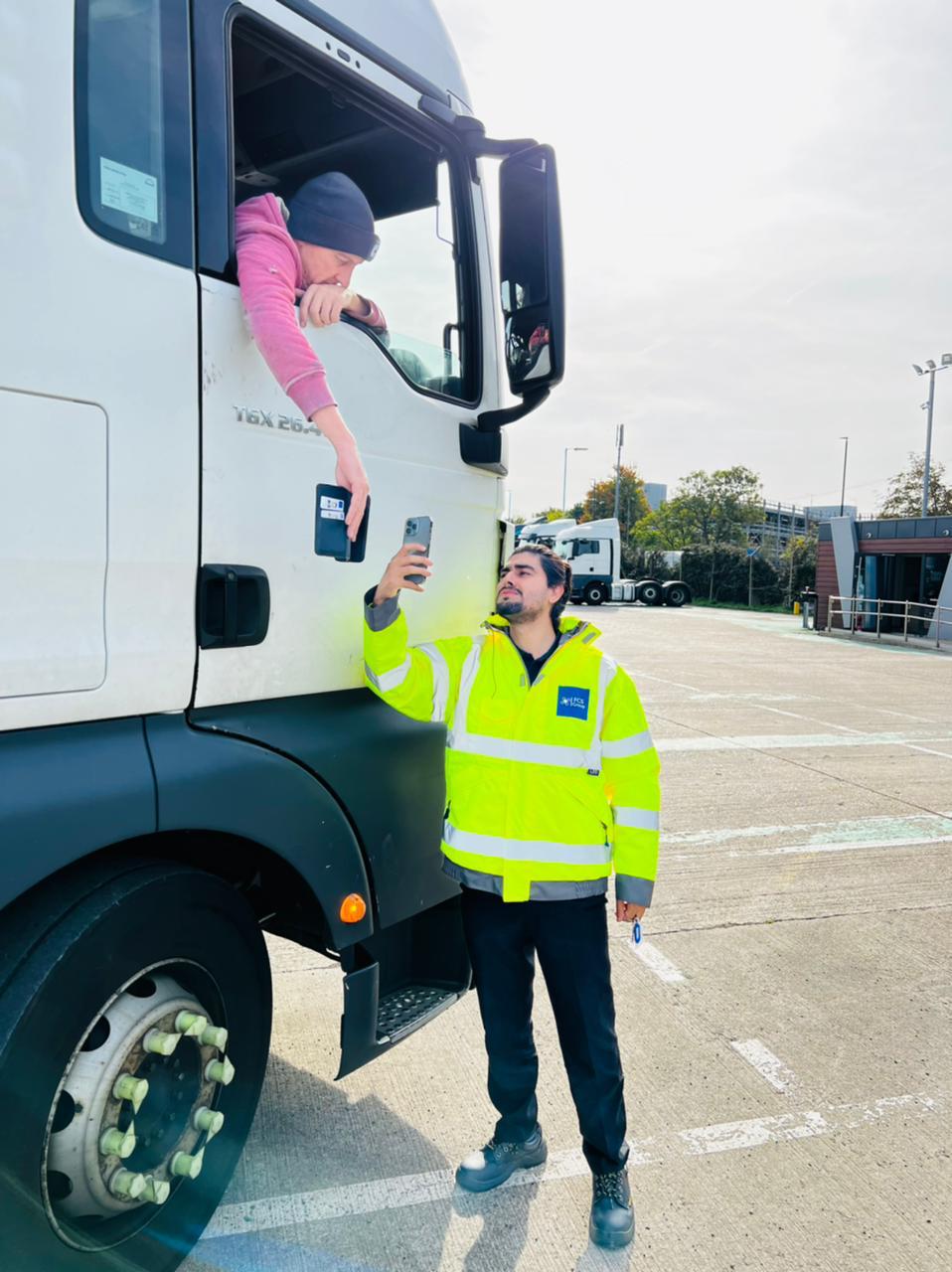 FCS Group gatehouse officer checking a lorry driver in at a yard