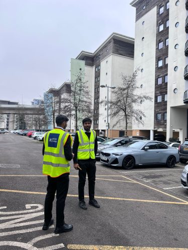 Two FCS Group security officers on patrol in a residential car park